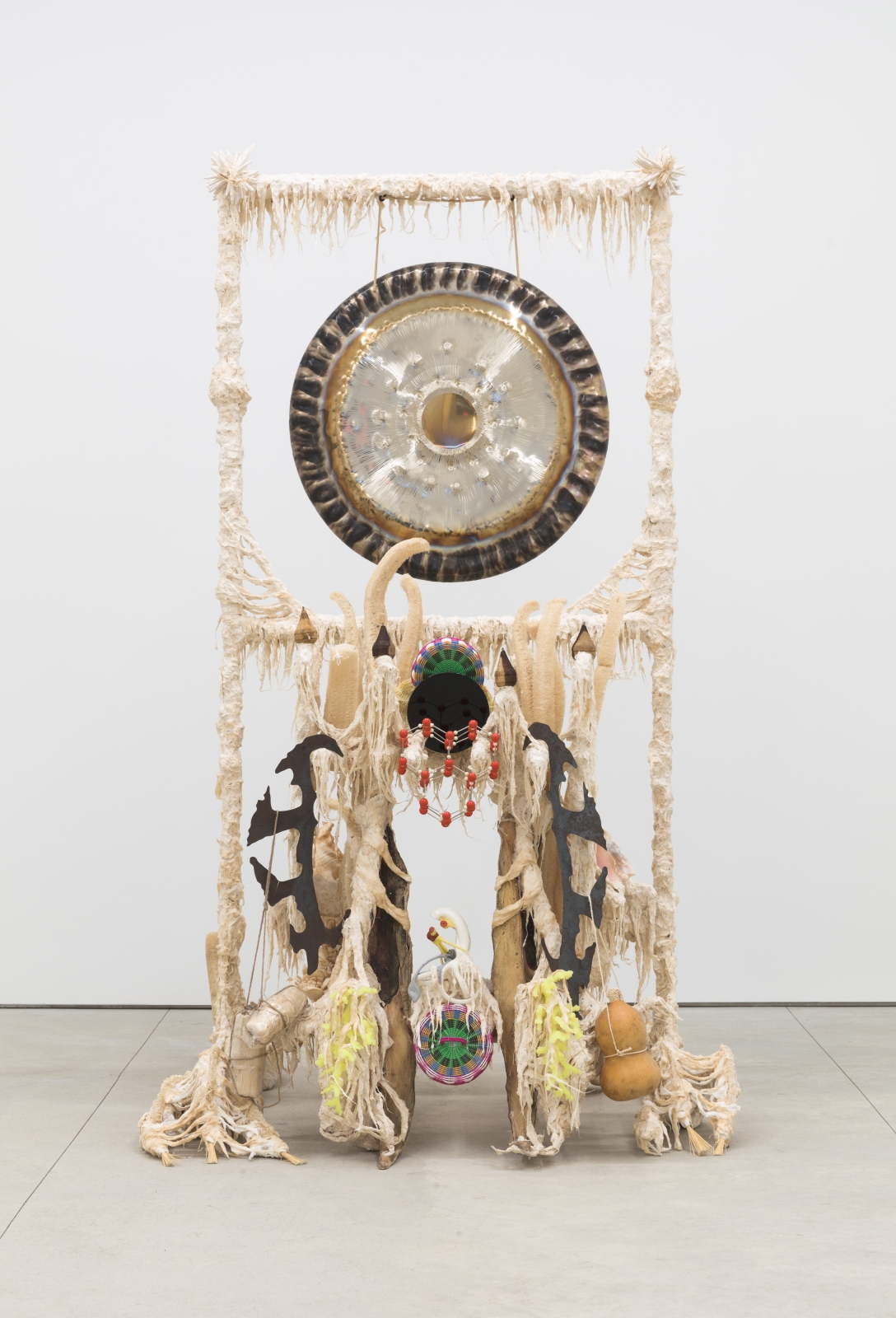 Guadalupe Maravilla
Disease Thrower #10, 2020
gong, steel, wood, cotton, glue mixture, plastic, loofah, and objects collected from a ritual of retracing the artist&amp;#39;s original migration route
96 x 57 x 63 ins.
243.8 x 144.8 x 160 cm